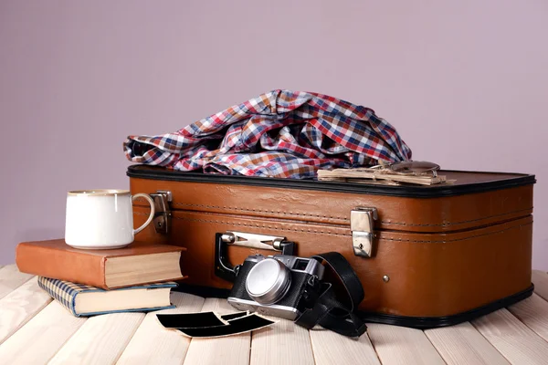 Vintage suitcase with clothes — Stock Photo, Image