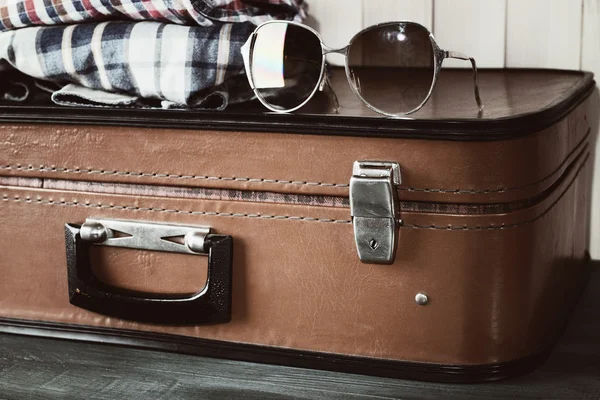 Vintage suitcase with clothes — Stock Photo, Image