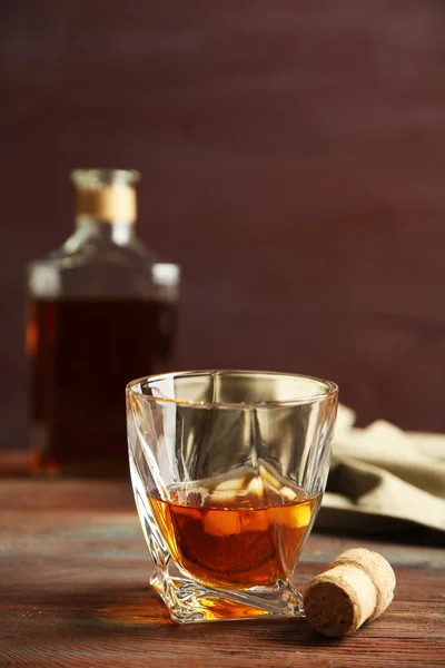 Whiskey on wooden background — Stock Photo, Image