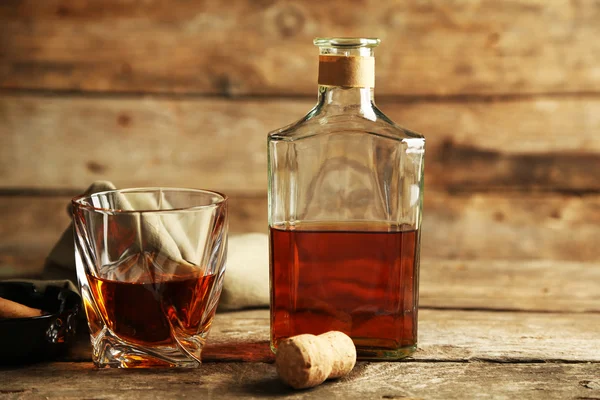 Whiskey on wooden background — Stock Photo, Image