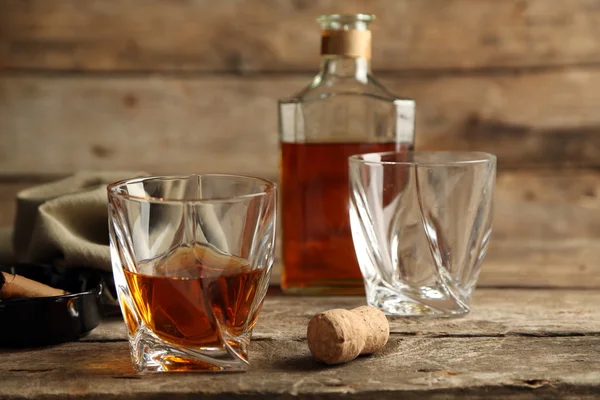 Whiskey on wooden background — Stock Photo, Image