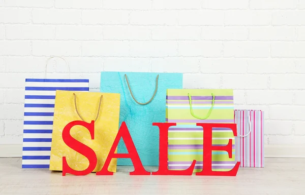 Sale with bags on floor — Stock Photo, Image