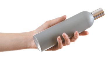 El ile üzerine beyaz izole kozmetik şişe