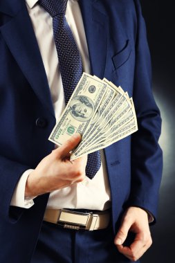 Businessman with dollars clipart