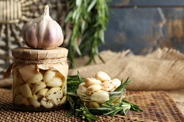 Canned garlic in glass jar — Stock Photo, Image