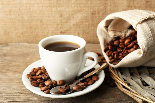 Cup of coffee with beans — Stock Photo, Image