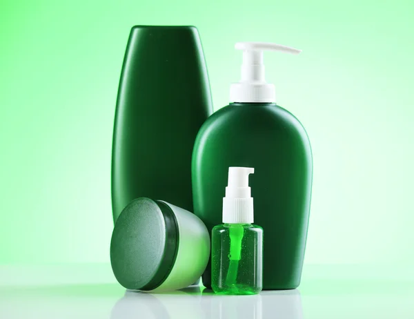 Cosmetic bottles on bright background — Stock Photo, Image