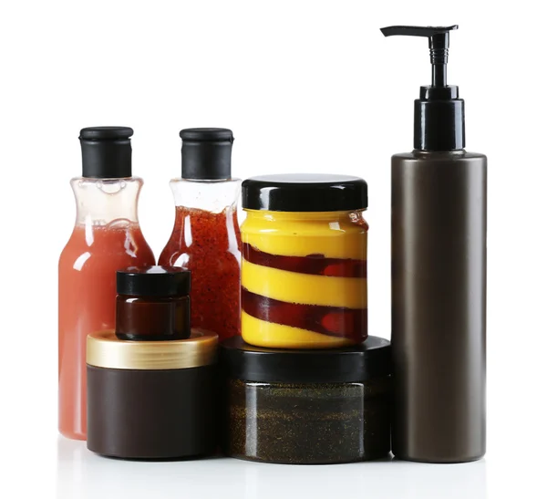 Bottiglie cosmetiche su sfondo chiaro — Foto Stock