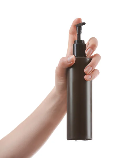 Weibliche Hand mit Kosmetikflasche isoliert auf weiß — Stockfoto