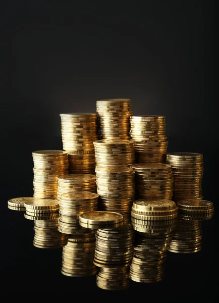 Pile of coins on dark background — Stock Photo, Image