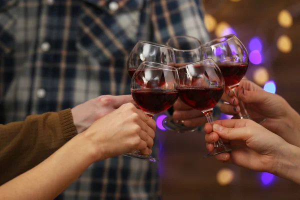 Clinking glasses of red wine — Stock Photo, Image