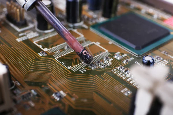 Repairing of motherboard, macro view — Stock Photo, Image