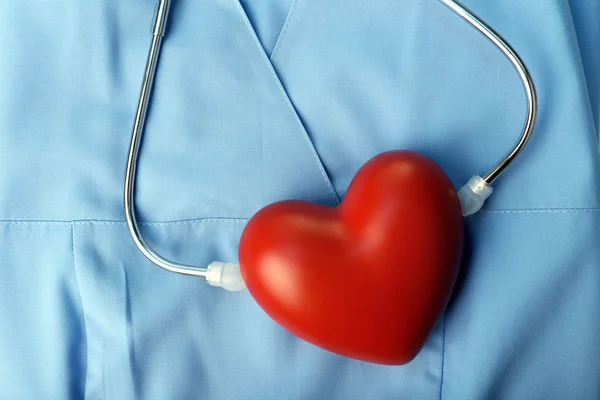 Stethoscope with heart on suit — Stock Photo, Image