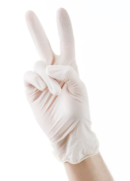 Arzt legt sterile Handschuhe an — Stockfoto