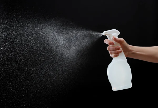 Male hand spraying water — Stock Photo, Image