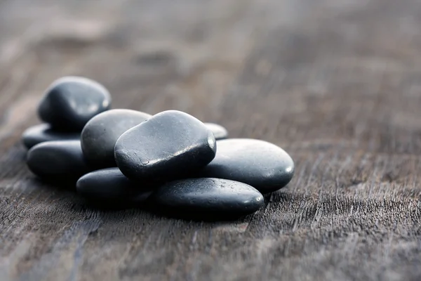 Stack of black sea pebbles — Stock Photo, Image