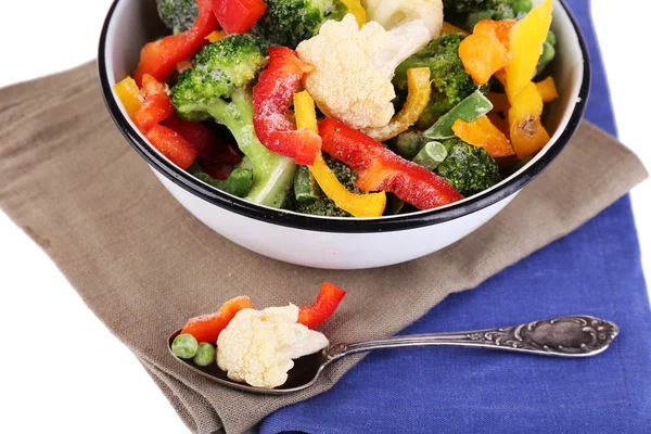 Frozen vegetables in bowl on napkin, isolated on white — Stock Photo, Image