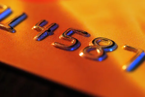 Numbers on plastic card on table — Stock Photo, Image