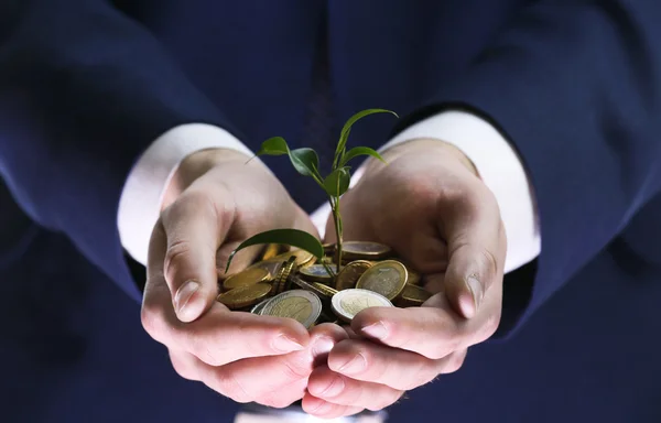 Handful of coins with growing sprout, closeup view — Stock Photo, Image