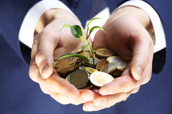 Handful of coins with growing sprout, closeup view — Stock Photo, Image