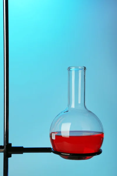 Fixed test tube on support on colorful background Stock Photo