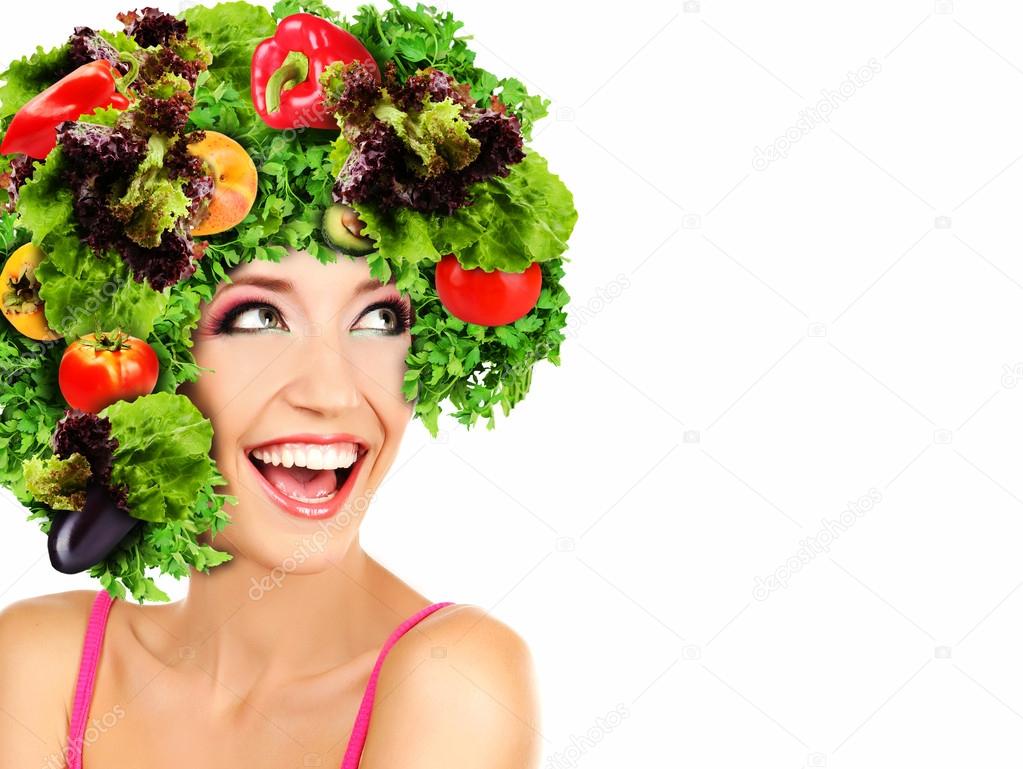 Beautiful young woman with vegetable wig isolated on white