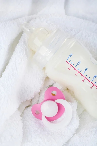 Baby milk bottle and pacifier — Stock Photo, Image