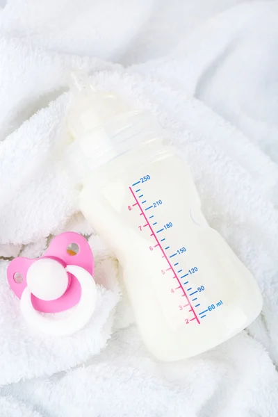 Baby milk bottle and pacifier — Stock Photo, Image