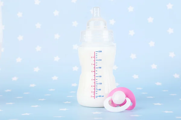 Baby milk bottle and pacifier — Stock Photo, Image