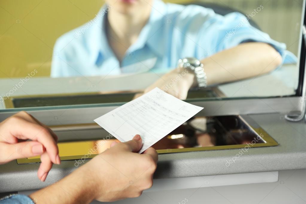 Teller window with working cashier. Concept of payment of utilities
