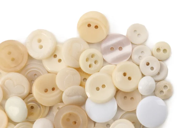 Bottoni da cucito beige isolati su bianco — Foto Stock