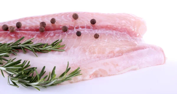 Pangasius fillet with pepper and rosemary sprigs isolated on white — Stock Photo, Image