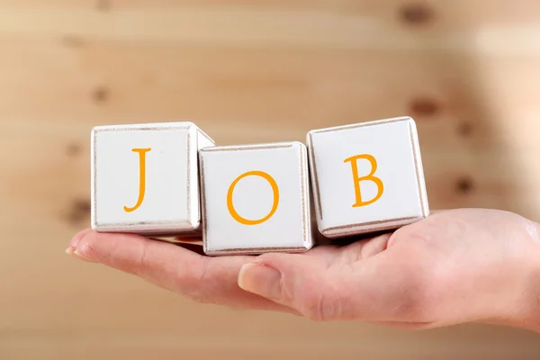 Arbeitswort mit Holzwürfeln buchstabiert — Stockfoto