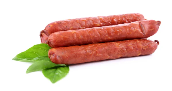 Smoked thin sausages  with basil leaves, isolated on white — Stock Photo, Image