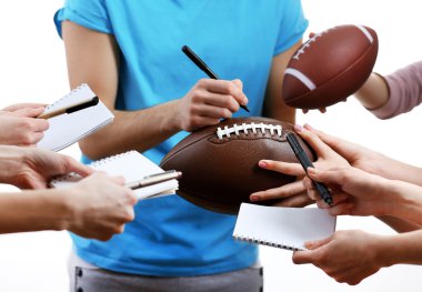 Autographs by American football star isolated on white background