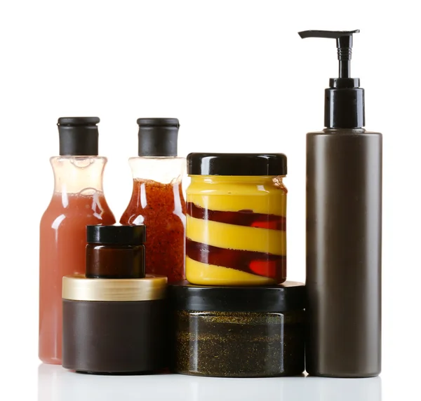 Botellas cosméticas sobre fondo claro —  Fotos de Stock