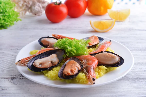 Seafood Paella on plate on table close-up — Stock Photo, Image