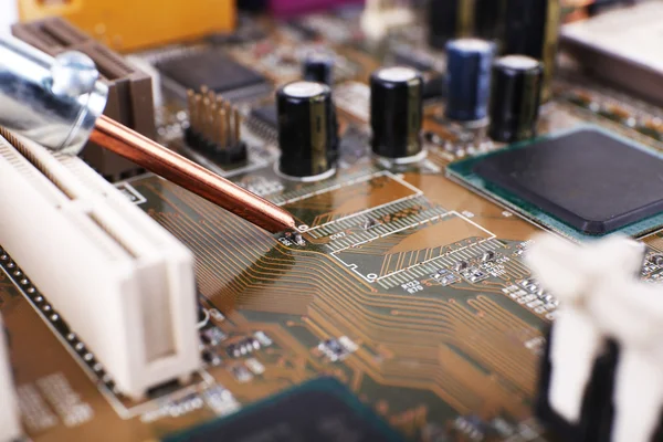 Repairing of computer motherboard, macro view — Stock Photo, Image