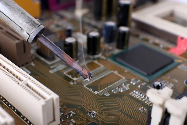 Repairing of motherboard, macro view — Stock Photo, Image