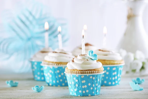 Delicious birthday cupcakes on table on light background — Stock Photo, Image