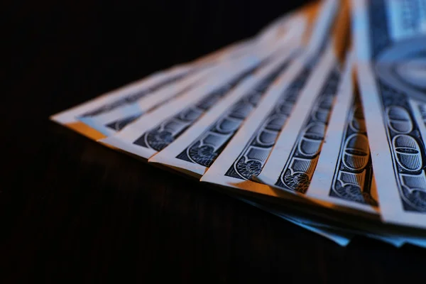 One hundred dollars banknotes on wooden table background — Stock Photo, Image