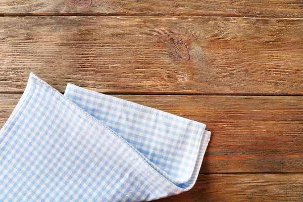 Napkin on wooden table — Stock Photo, Image