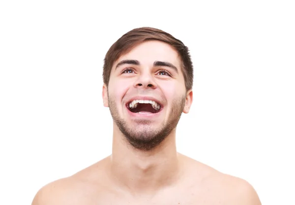 Porträt eines jungen lächelnden Mannes auf weißem Grund — Stockfoto