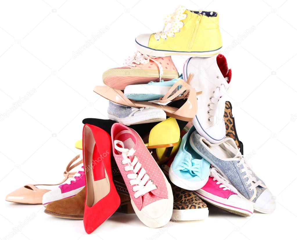 Pile of various female shoes isolated on white Stock Photo by