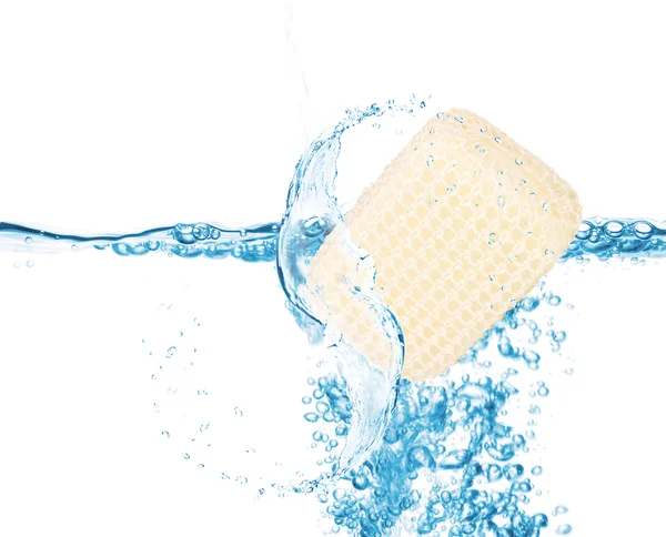 Soft sponge in water splash isolated on white — Stock Photo, Image