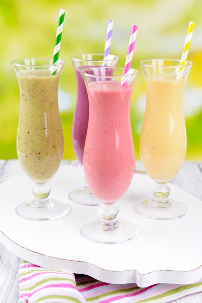 Delicious berry cocktails on table on bright background — Stock Photo, Image