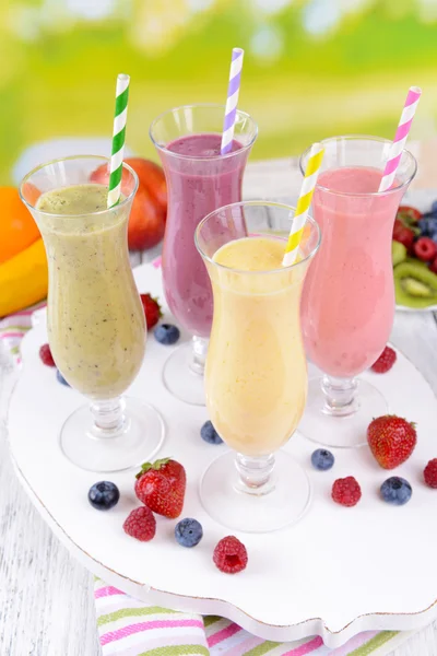 Delicious berry cocktails on table on bright background — Stock Photo, Image