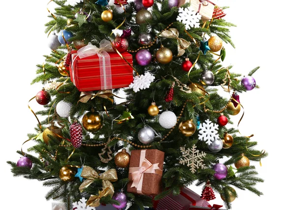 Decorated Christmas tree on floor on light wall background — Stock Photo, Image