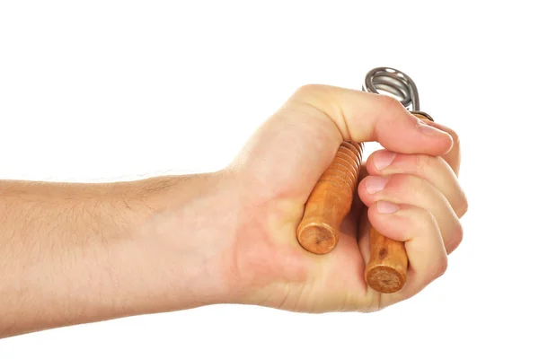 Entrenador de mano con muelle de acero en mano masculina, aislado en blanco — Foto de Stock