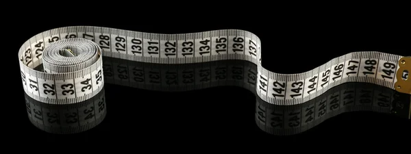 Measuring tape on black background — Stock Photo, Image